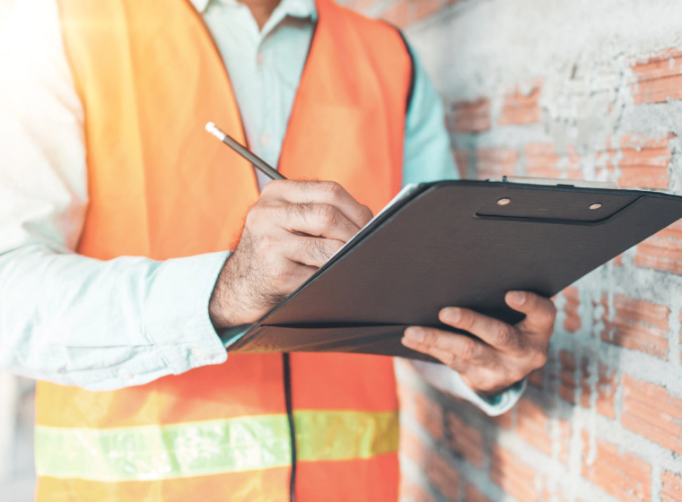 house inspection for bright star worker with a black listing table and a pen checking some commercial stuff